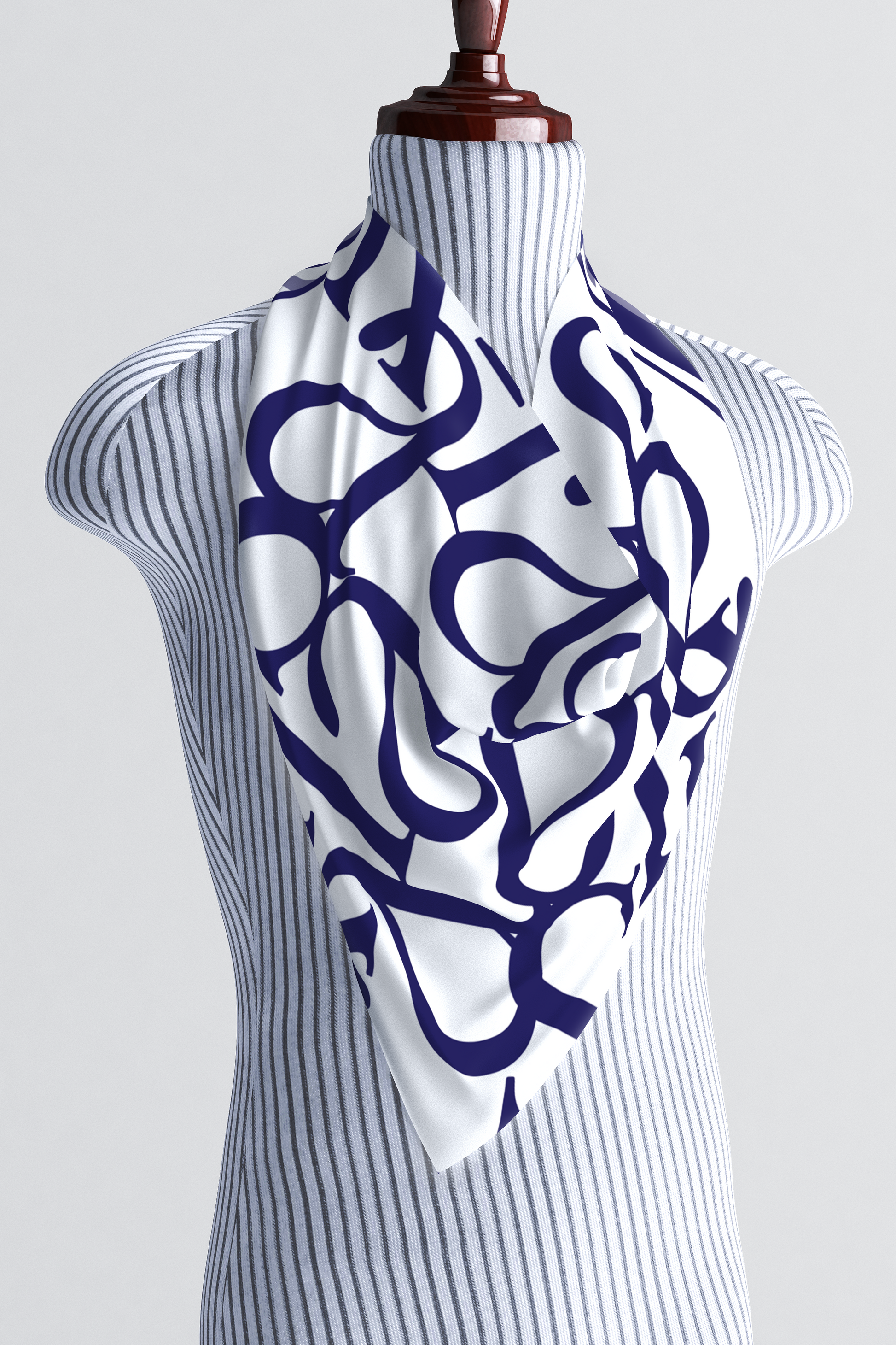 White silk scarf with a blue "kalisa" script pattern tied around the neck