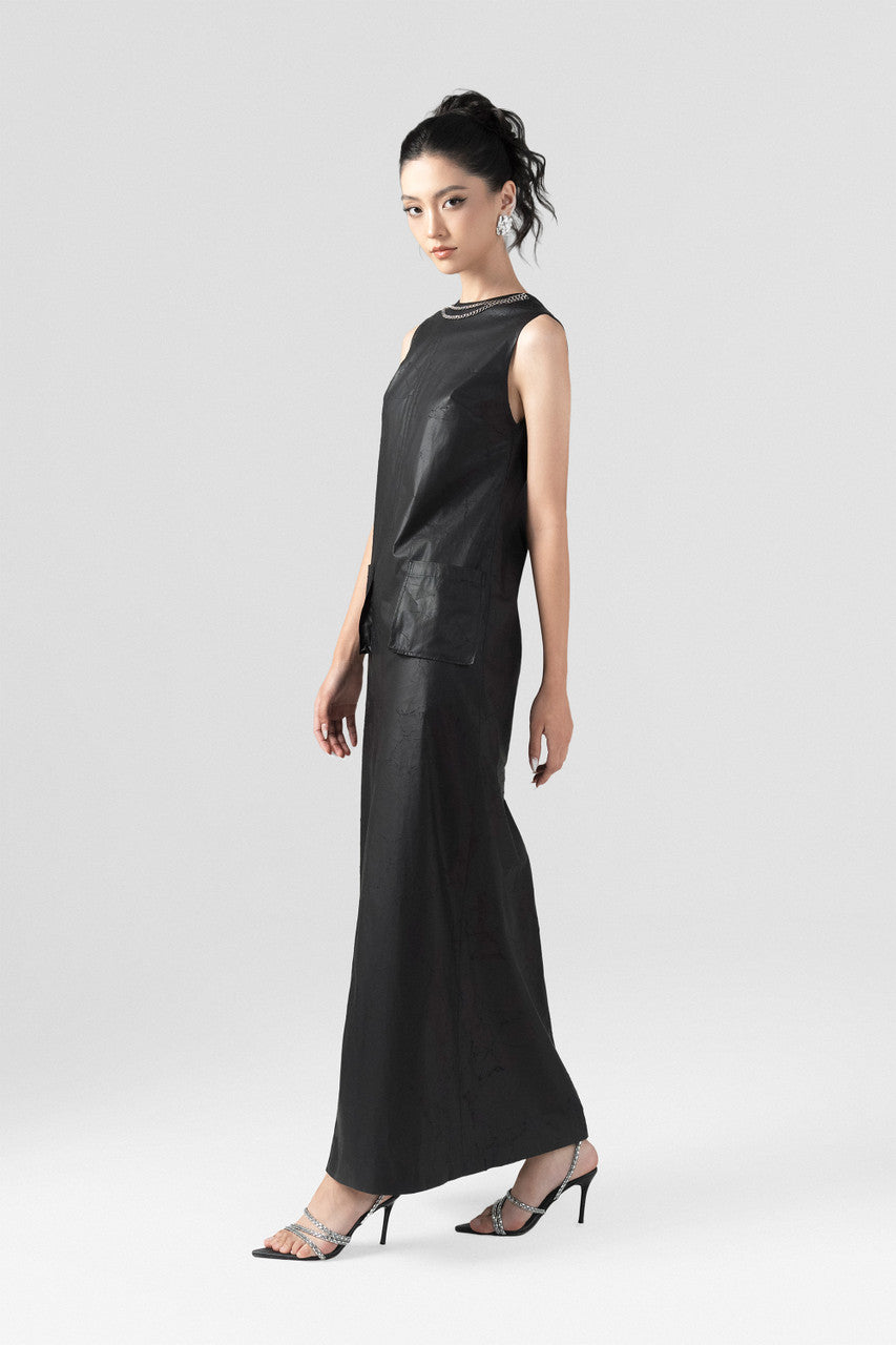 The Black A-Line Maxi Dress features a sleek silhouette with a chic chain-accented neckline.