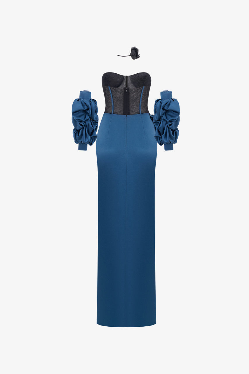 A navy blue silk dress, featuring a structured black mesh corset, detachable puffed sleeves, and a striking high slit.