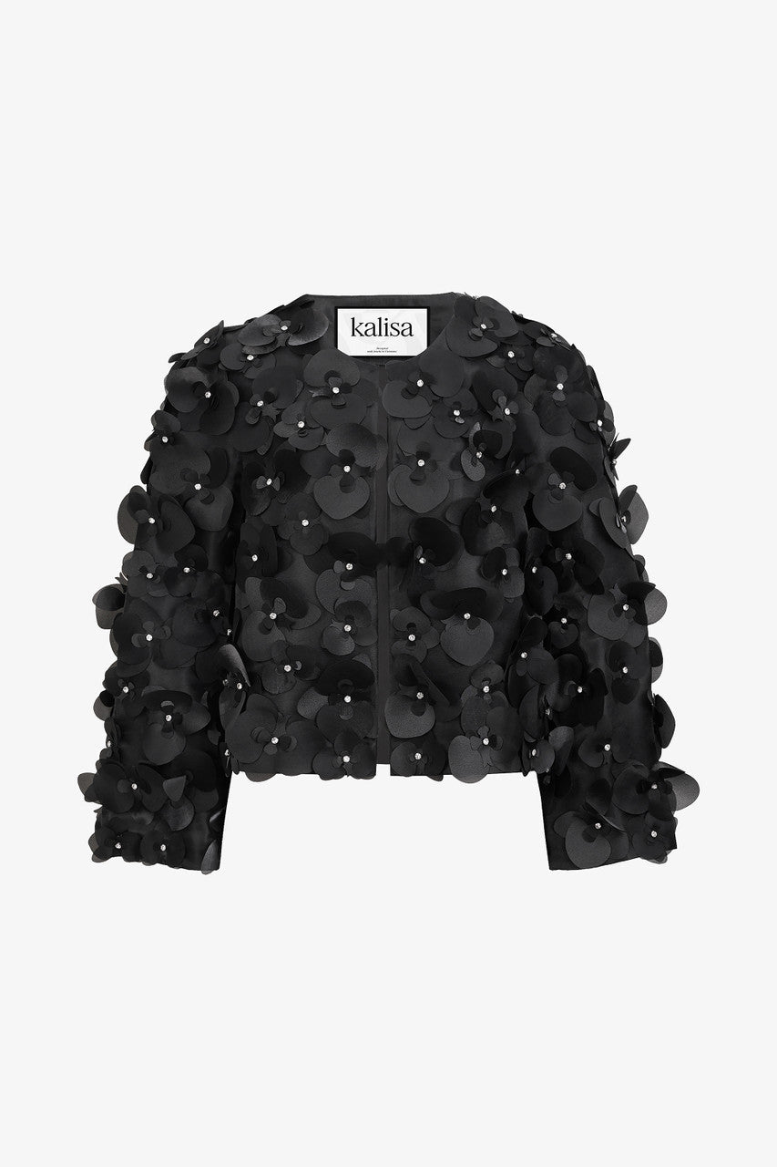 Cropped black jacket in satin, with long sleeves and orchid embellishments.
