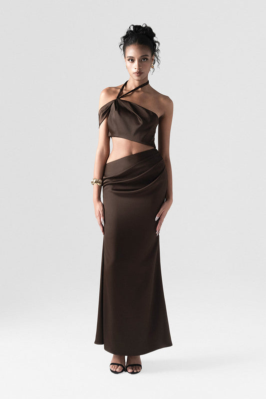 Brown maxi dress in premium silk, crafted with side cutouts, high side slit, and handwoven neck strap.