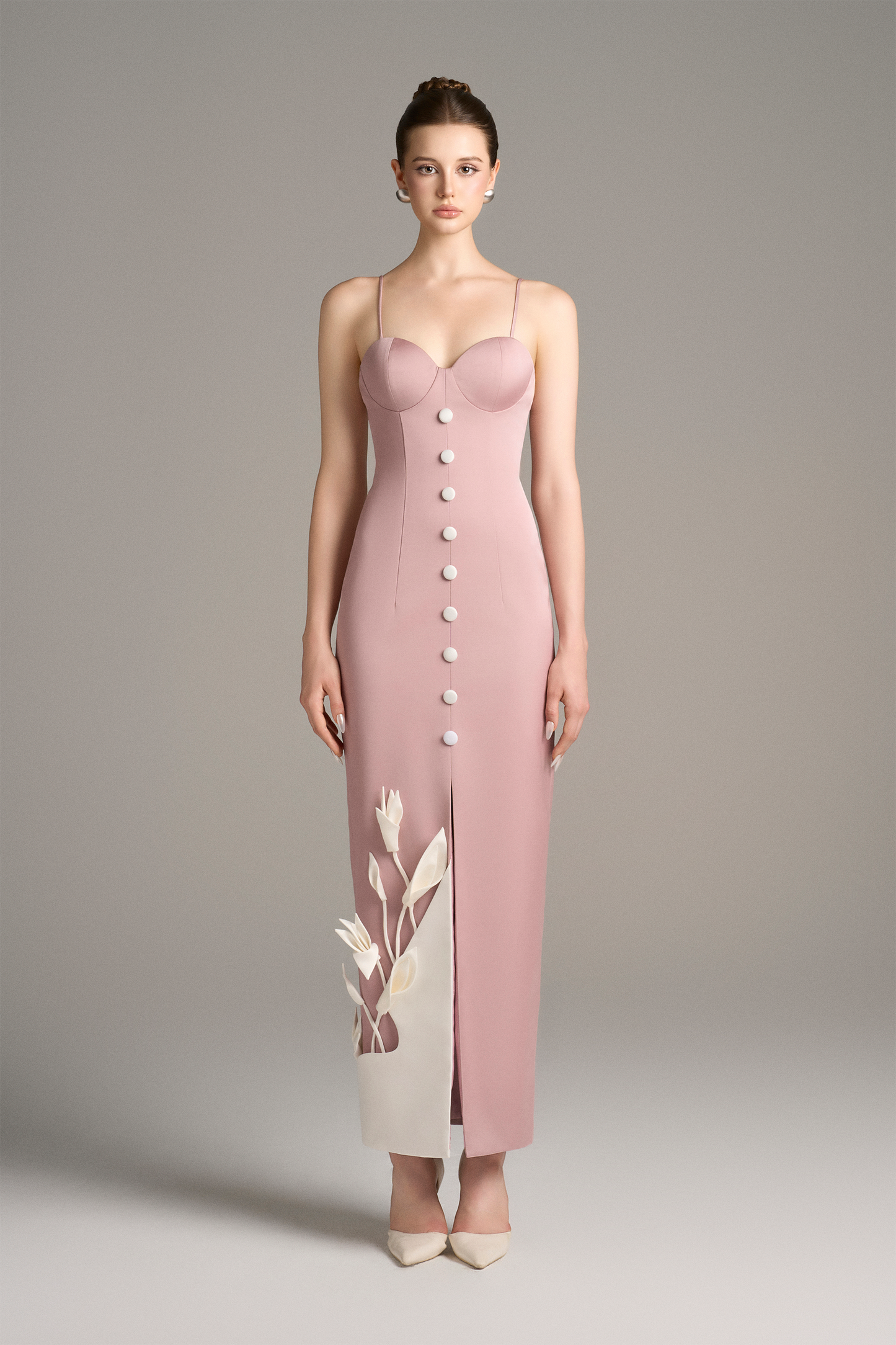Model wearing a pink dress with buttons