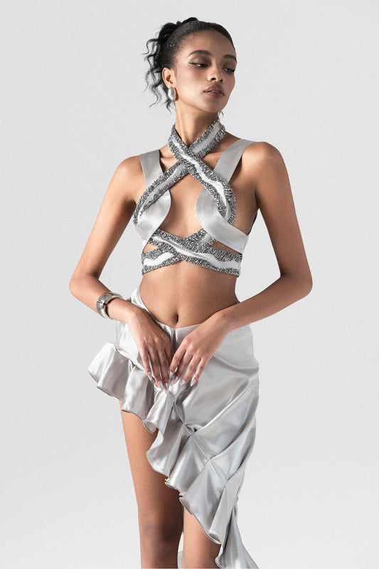 beaded cross-strap crop top, paired with a asymmetrical skirt, made of silver grey silk satin.