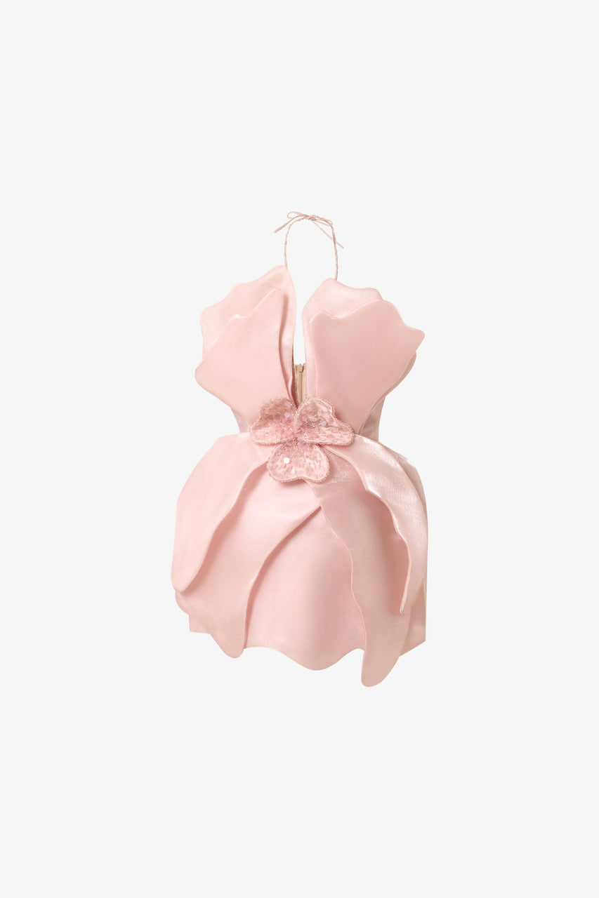A pink mini dress in silk organza. Premium crystal embellishments, orchid petal-inspired cutouts, and string-neck design.