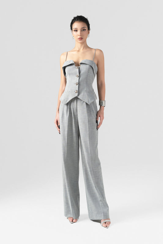 A grey tweed set, featuring a sleeveless waistcoat top with thin spaghetti straps, and long, straight-leg pants.