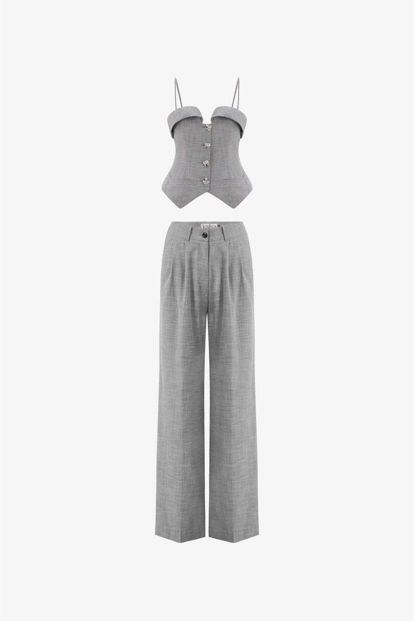 A grey tweed set, featuring a sleeveless waistcoat top with thin spaghetti straps, and long, straight-leg pants.