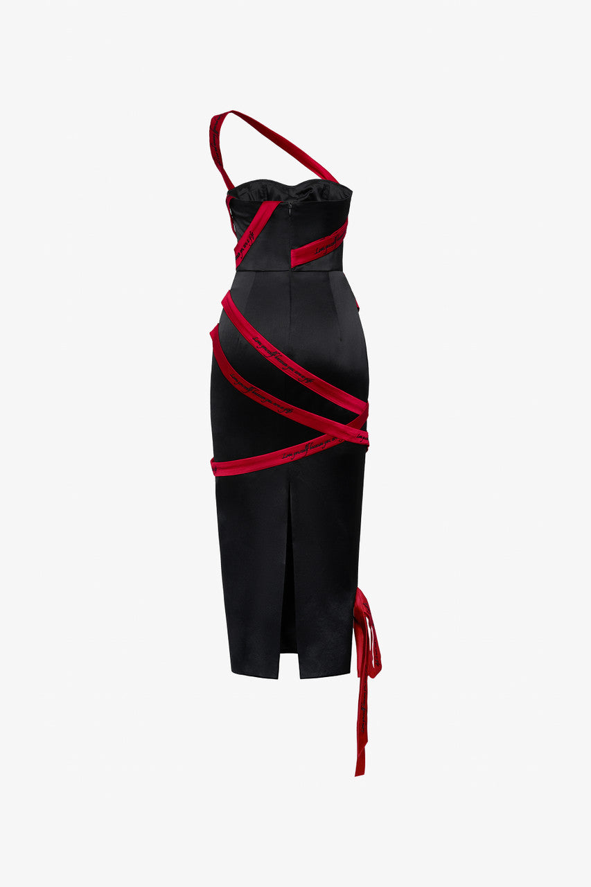 A silk midi dress in black with red embroidered lines.