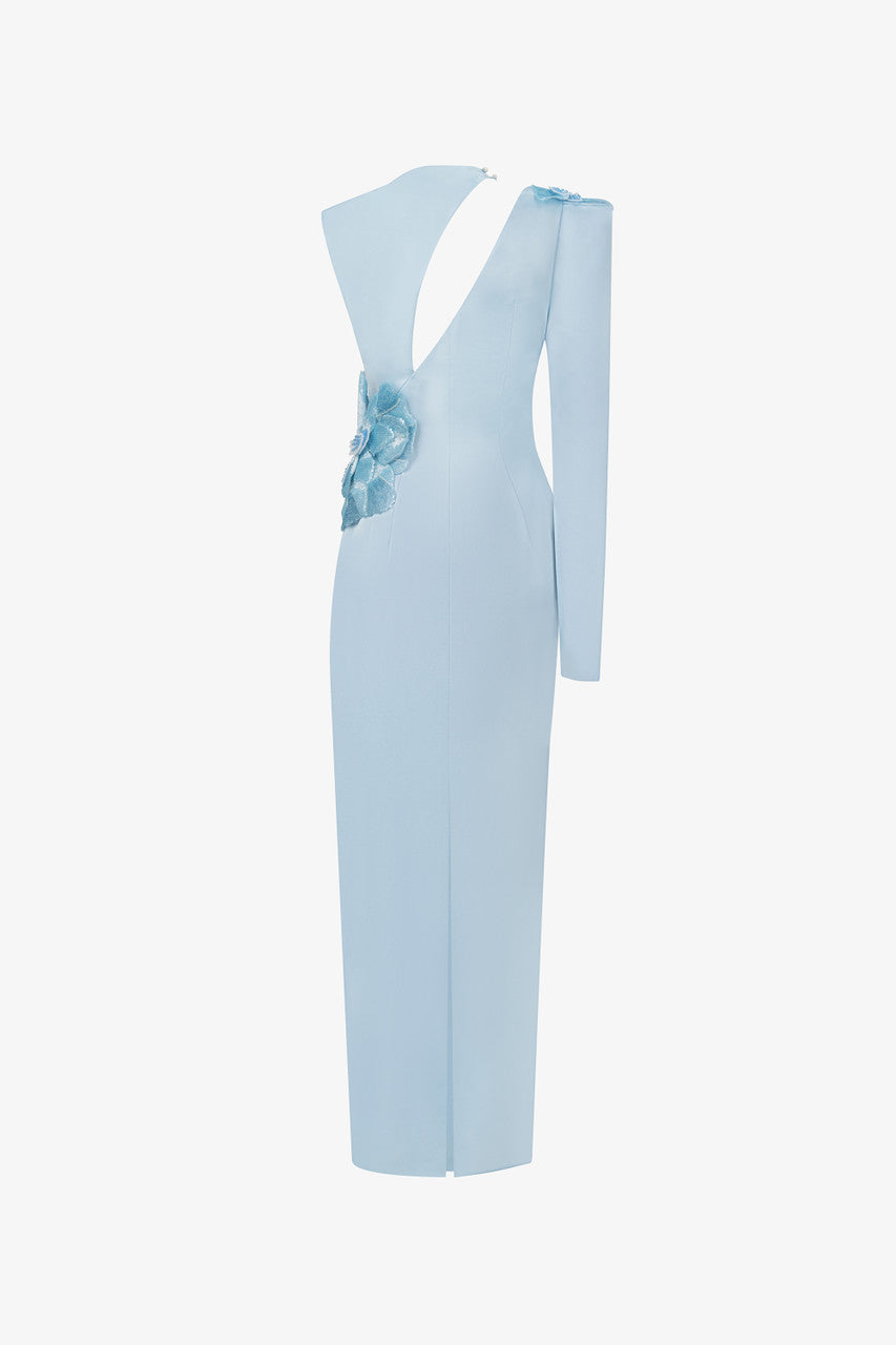 A blue silk maxi dress, with sequin floral accents and asymmetrical design.