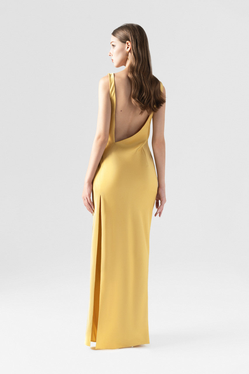 The gold yellow maxi dress, featured cowl neckline with pleats, a side slit and back cutouts.
