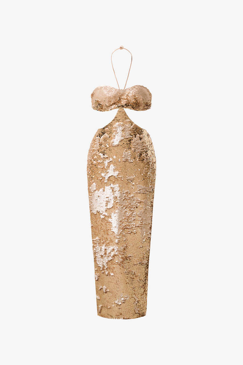 An evening dress in shimmering gold sequins. Bra-style bodice and bold cut-outs at the waist.