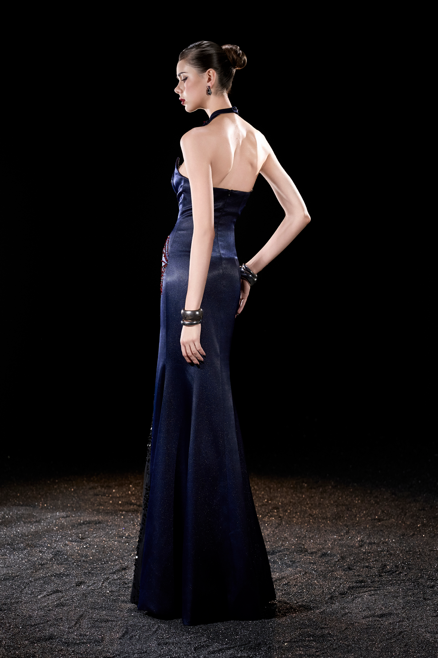 Woman in a dark blue evening gown