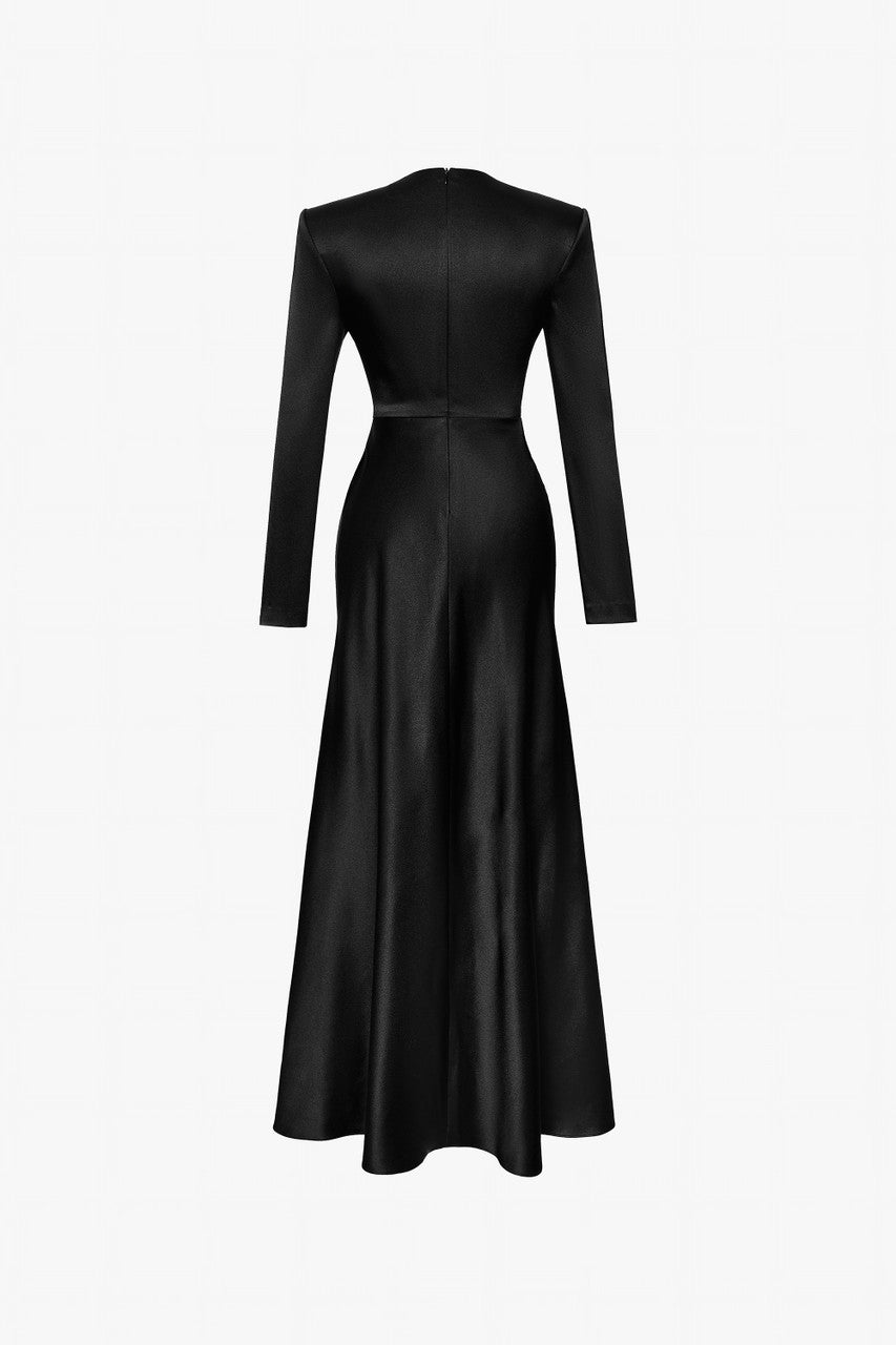 A black silk gown with handcrafted bead embellishments and a high-thigh slit.