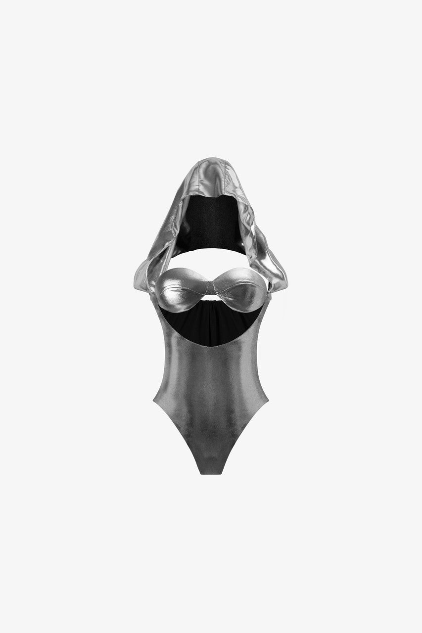 Metallic grey bodysuit with a hood detail and a black taffeta mini skirt.