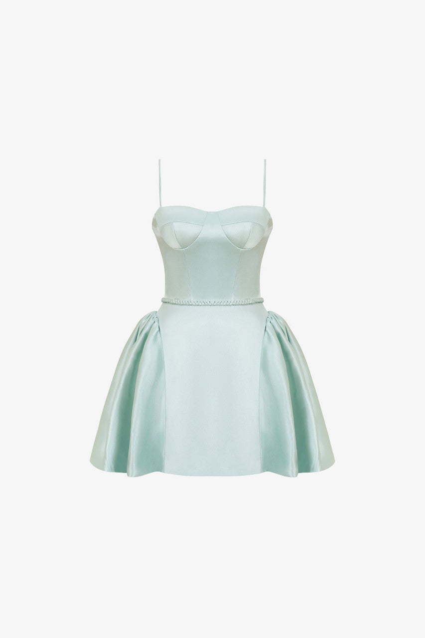 The green silk mini dress with woven tie detail around the waist, sleek spaghetti straps and slightly flared skirt.