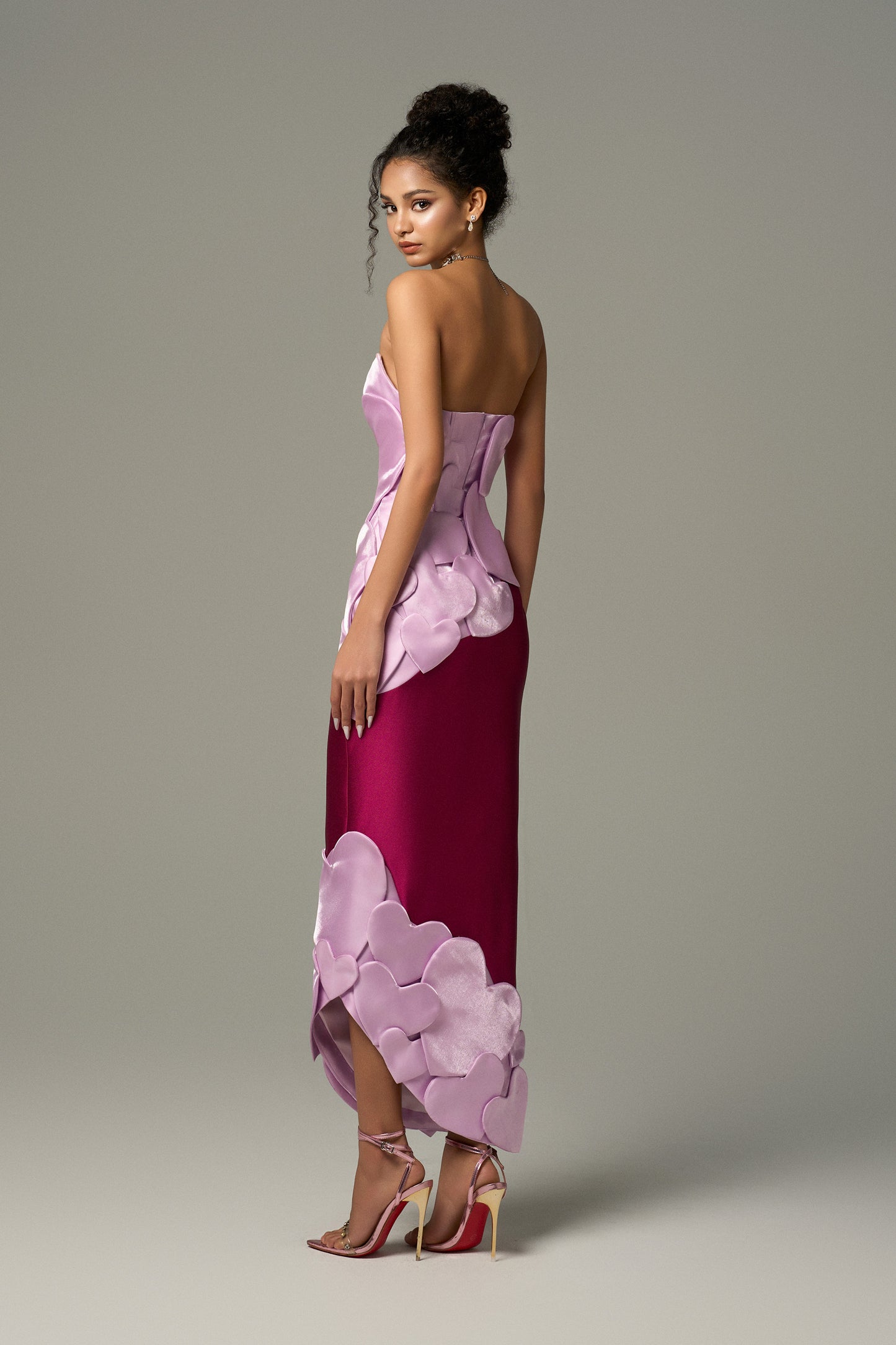 Heart-shaped maxi dress combines purple and pink tones, heart motifs on the body of the dress.