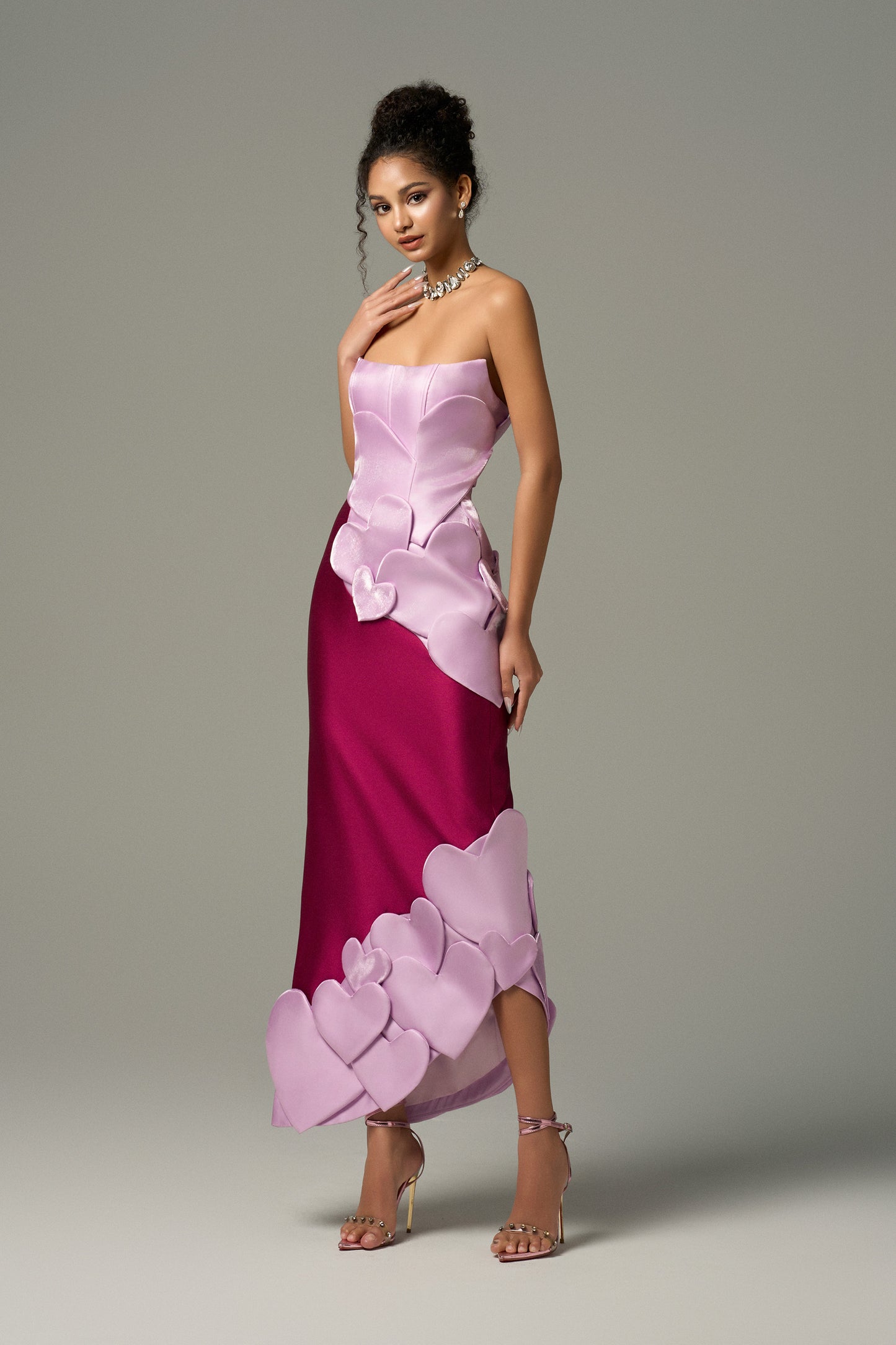 Heart-shaped maxi dress combines purple and pink tones, heart motifs on the body of the dress.