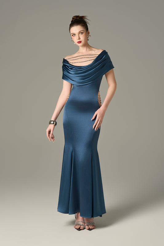 Navy silk maxi dress with a draped neckline and wide-shoulder short sleeves, cutouts on the both sides.