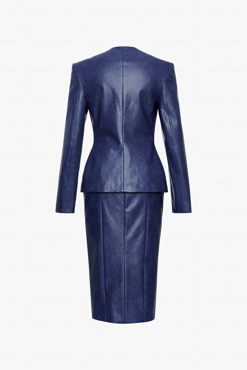 A navy set in crocodile-patterned leather, featuring a structured jacket and a pencil skirt.