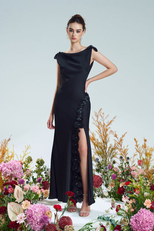 Black silk dress, adorned with daring slit and crystal floral details.