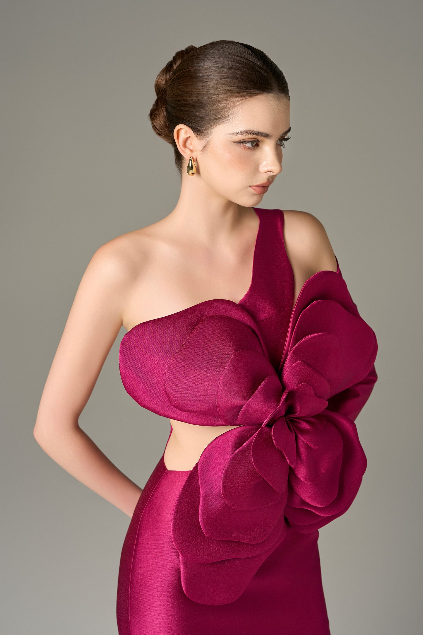 Pink Petal Floral Maxi Dress features an asymmetrical one-sleeve design with layered floral details.