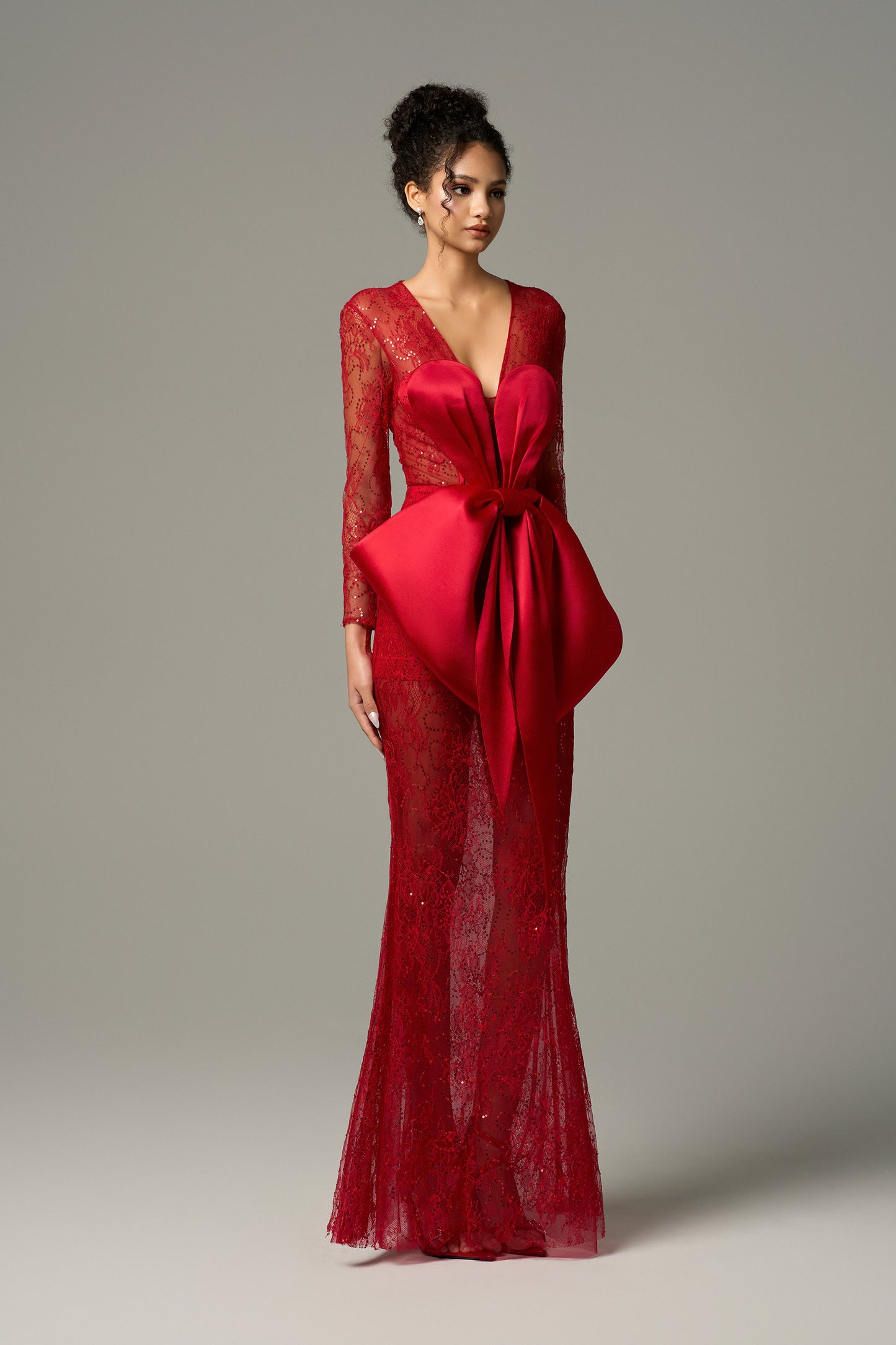 Red long sleeve lace maxi dress with oversized silk bow and sheer lace.