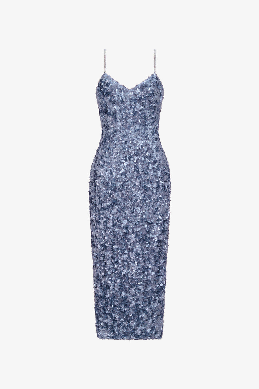 The dazzling grey sequin dress features spaghetti straps and a subtle back slit.