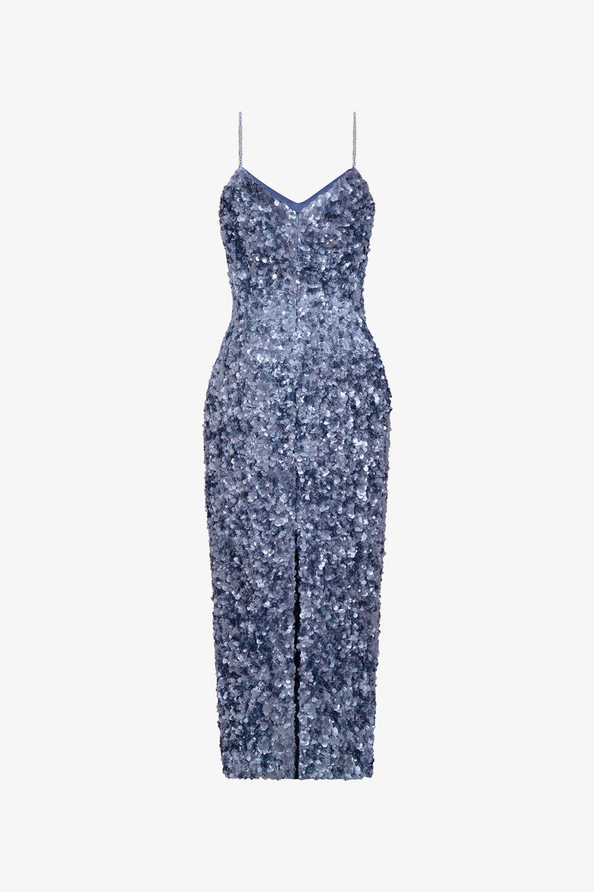 The dazzling grey sequin dress features spaghetti straps and a subtle back slit.