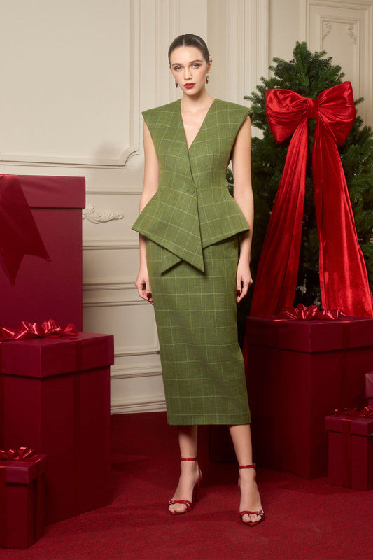 The sleeveless top with a crisscross placket detail, paired with a form-fitting pencil skirt, crafted from premium green tweed.