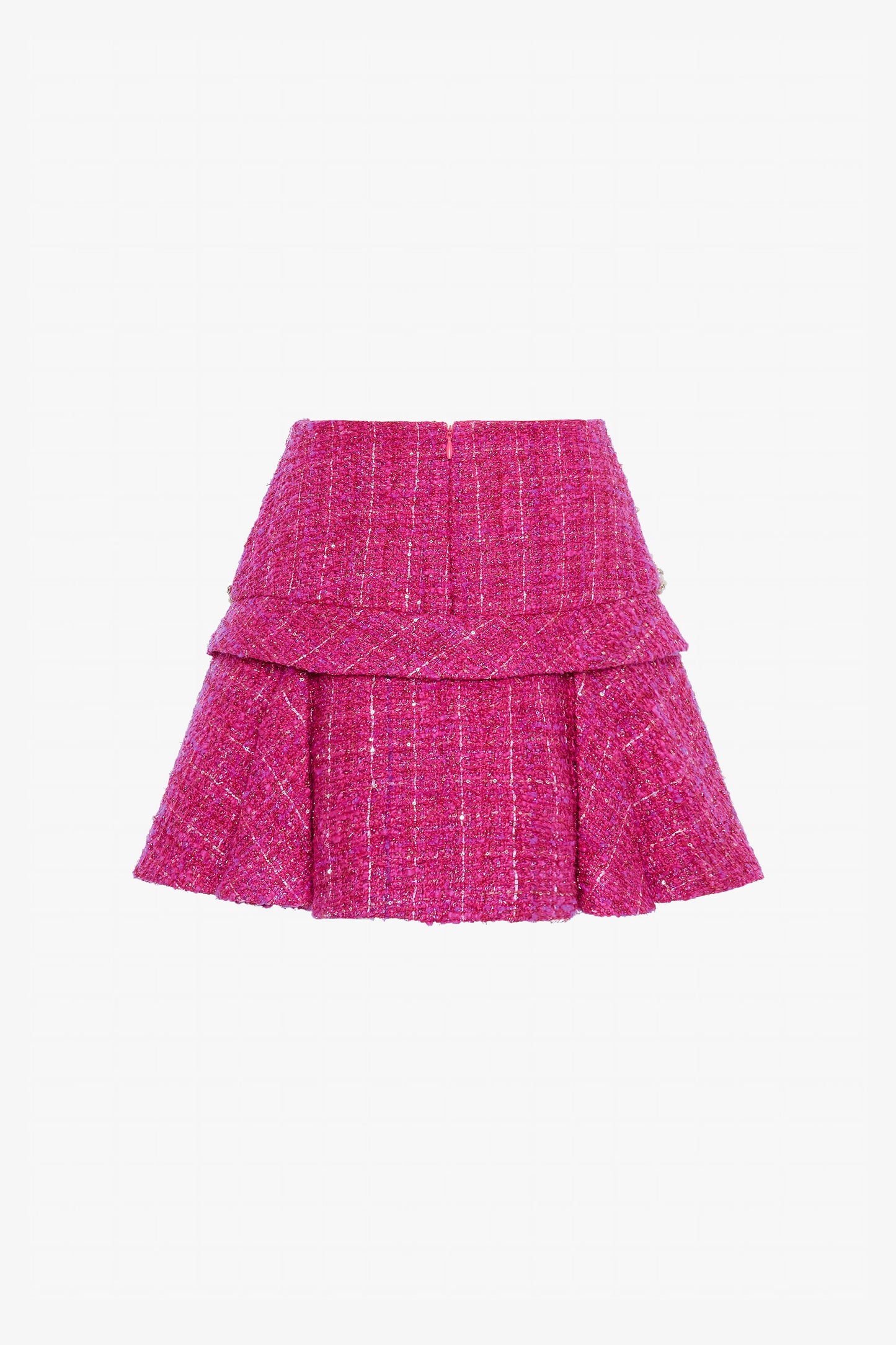 The pleated mini skirt is adorned at the waistline.