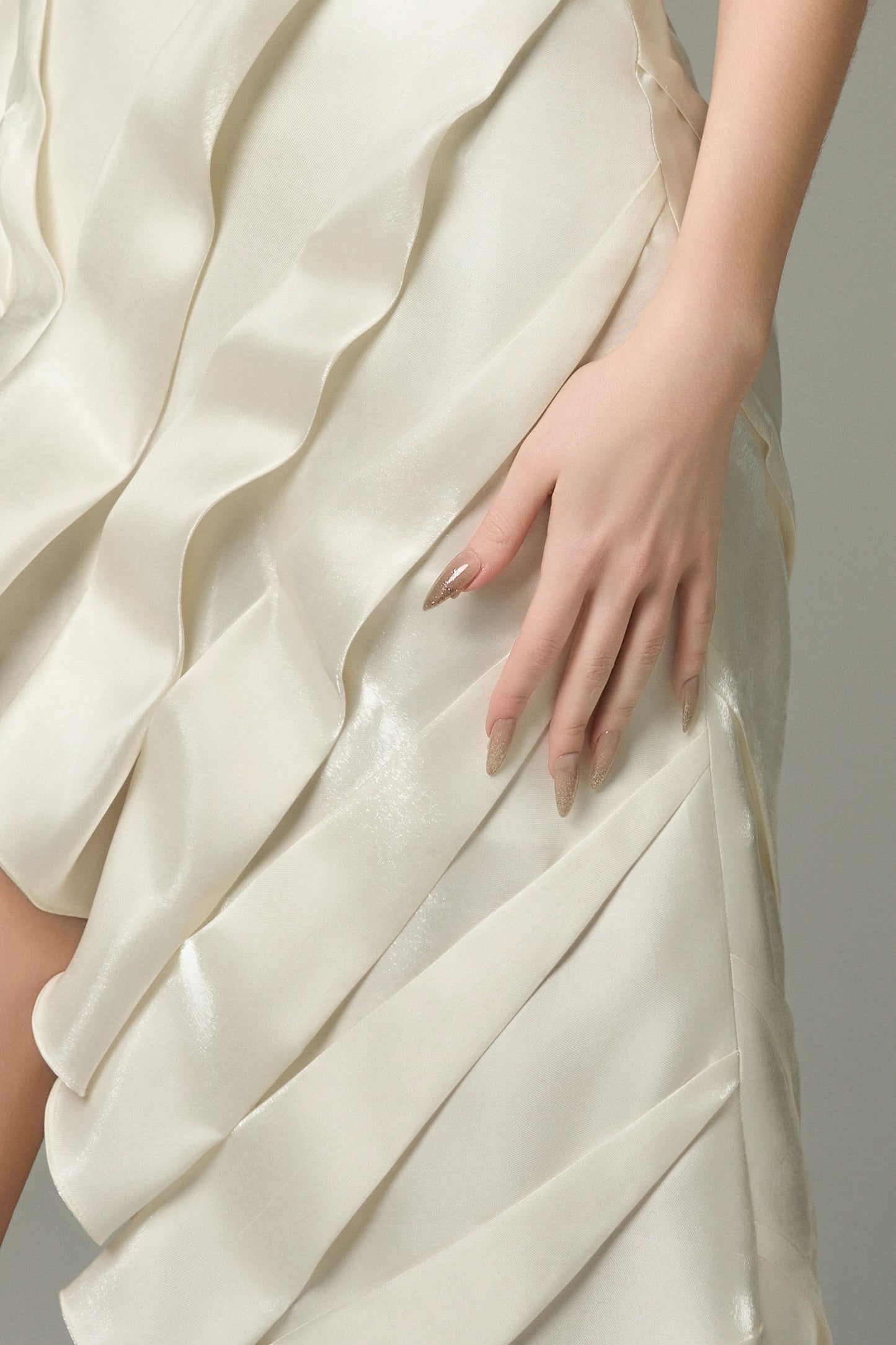 The cream split maxi dress drapes beautifully and is ideal for statement-making moments.