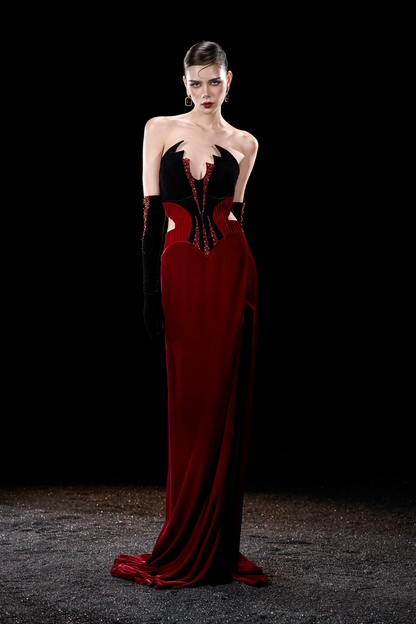 Woman wearing a red and black evening gown