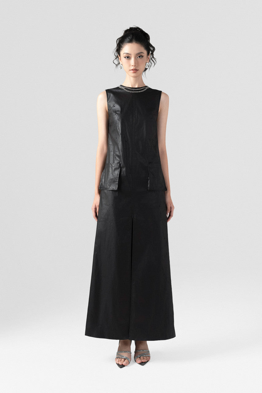 The Black A-Line Maxi Dress features a sleek silhouette with a chic chain-accented neckline. 