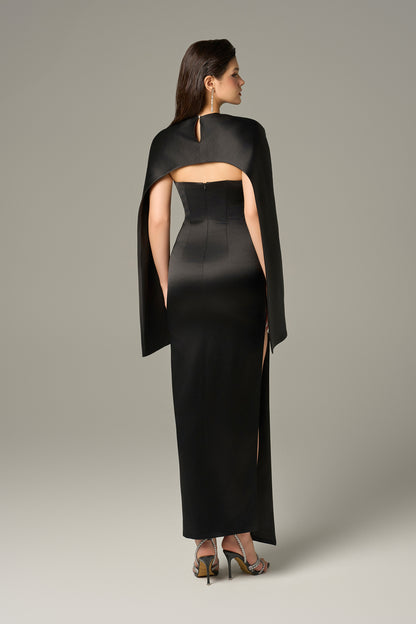 Black maxi gown hugging the waist. 