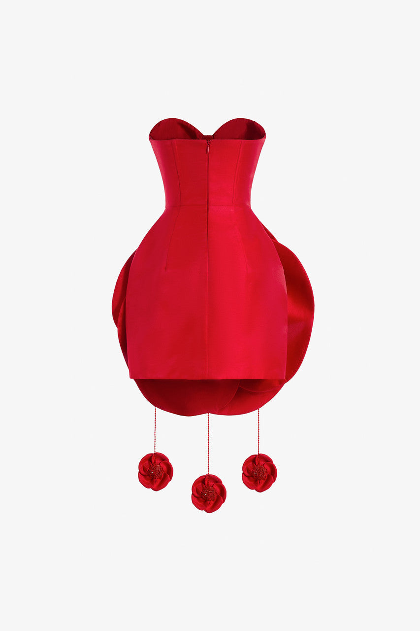A red taffeta mini dress, featuring a cat-eye bust and a voluminous flower-like skirt with rose accents.