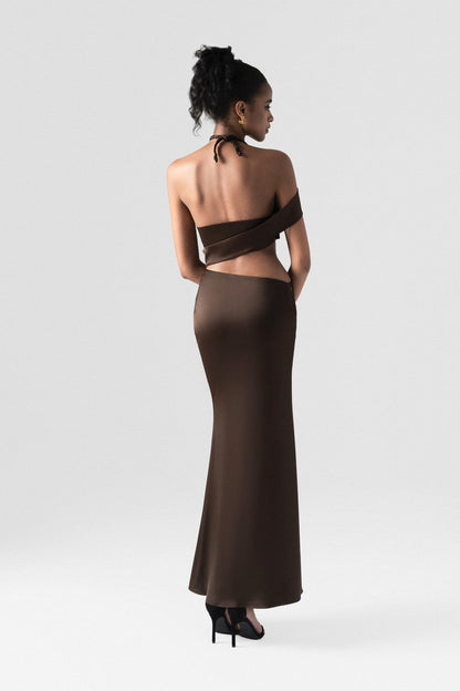 Brown maxi dress in premium silk, crafted with side cutouts, high side slit, and handwoven neck strap.