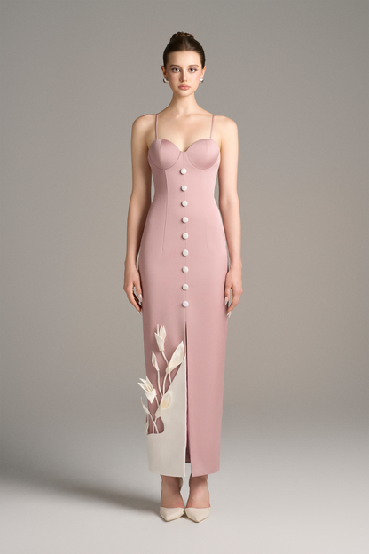 Model wearing a pink dress with buttons
