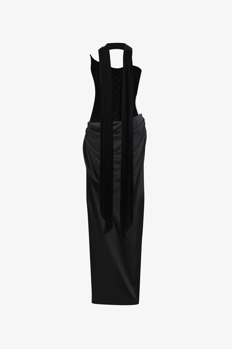 The black maxi dress, combining two premium fabrics: velvet and silk, featuring a matching silk scarf and gloves. 