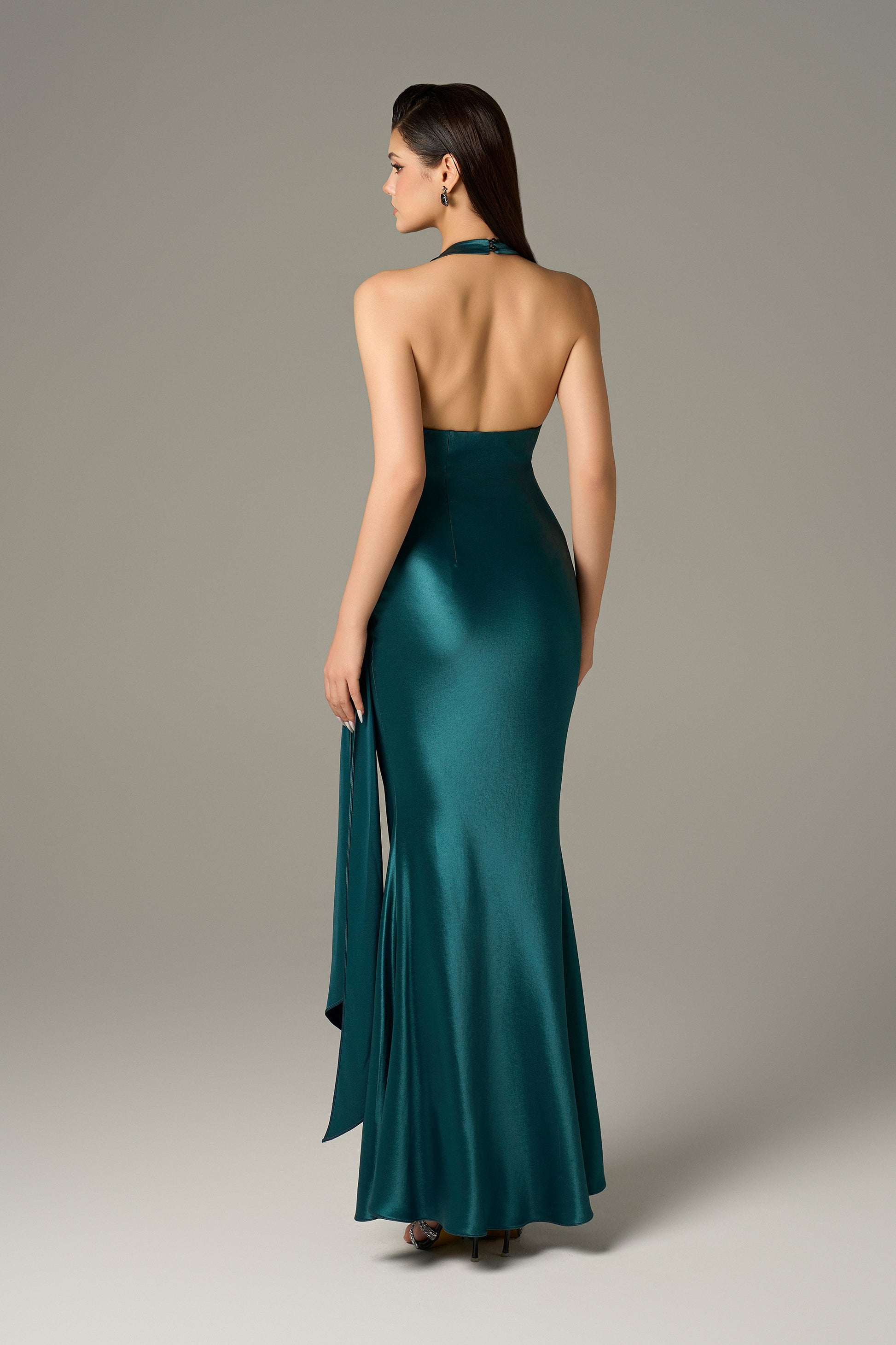 Maxi dress in dark mallard silk, with a halter neckline and a draped detail.