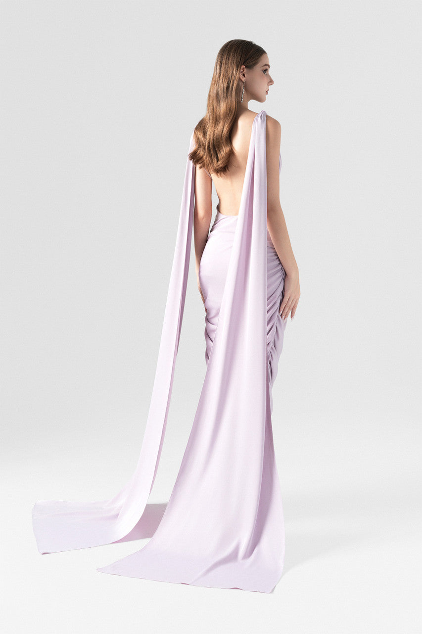 A purple silk dress with V-neckline and two flowing silk flaps. 