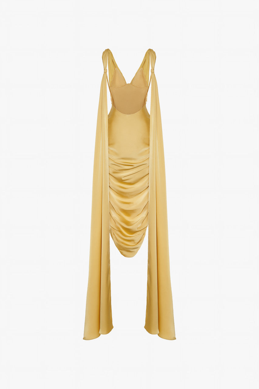 A gold yellow silk dress with V-neckline and two flowing silk flaps. 