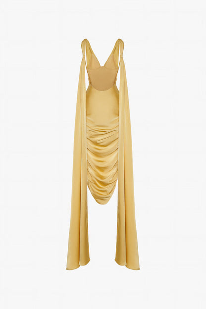 A gold yellow silk dress with V-neckline and two flowing silk flaps. 