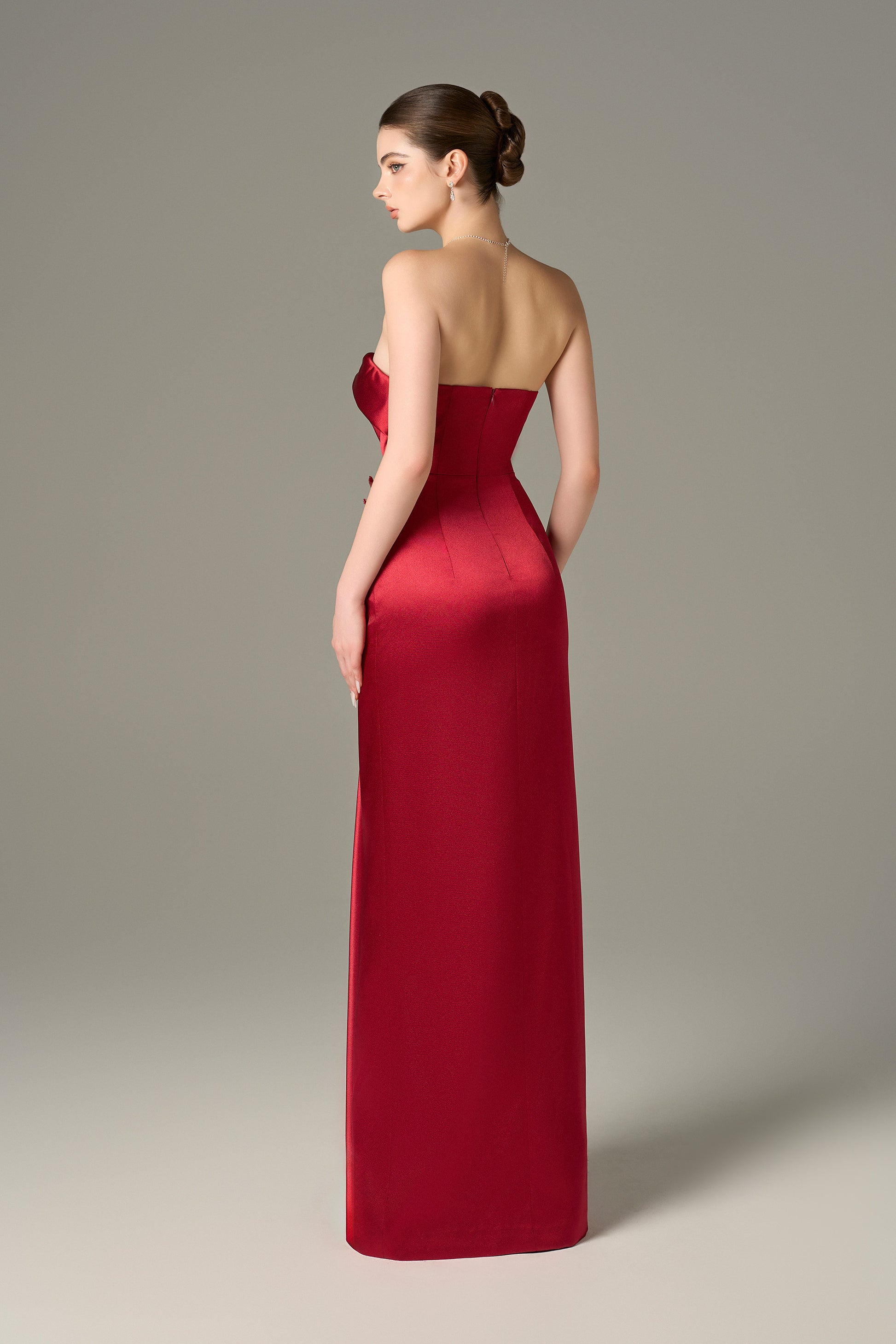 The Red Satin Silk Maxi Dress stuns with a 3D pleated heart bodice, sequin floral details and a  thigh-high slit.