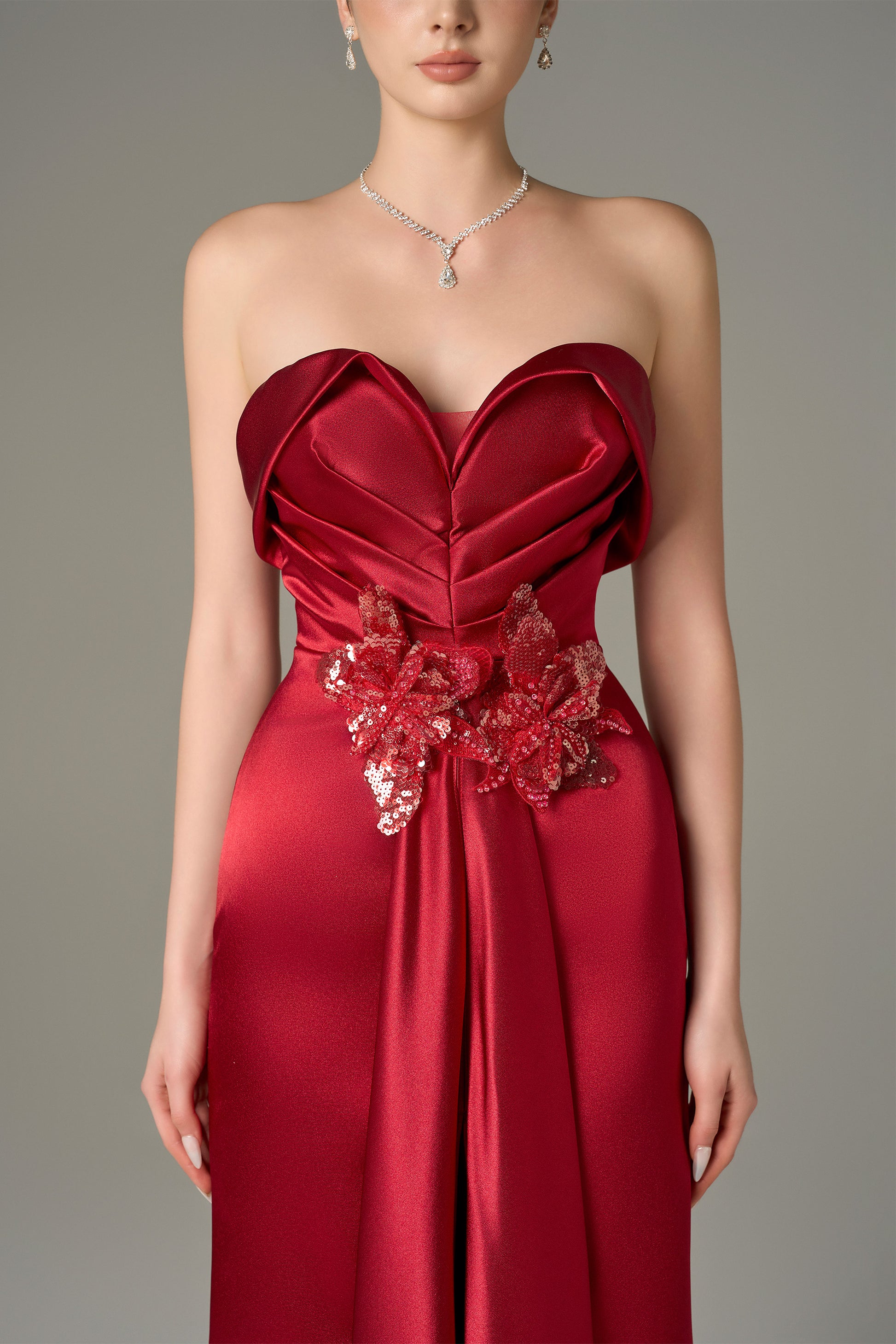 The Red Satin Silk Maxi Dress stuns with a 3D pleated heart bodice, sequin floral details.