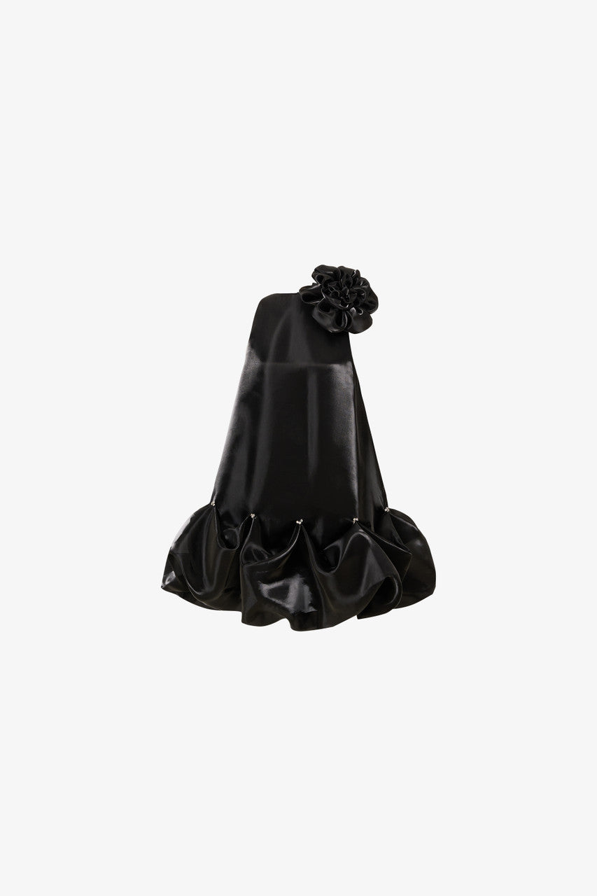 The black mini dress, featuring a oversized floral accent at the neckline and a bubble hem. 