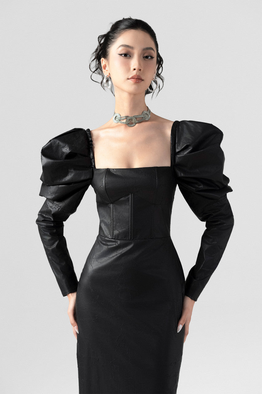 Black leather maxi dress with a square neckline and puffed long sleeves. 