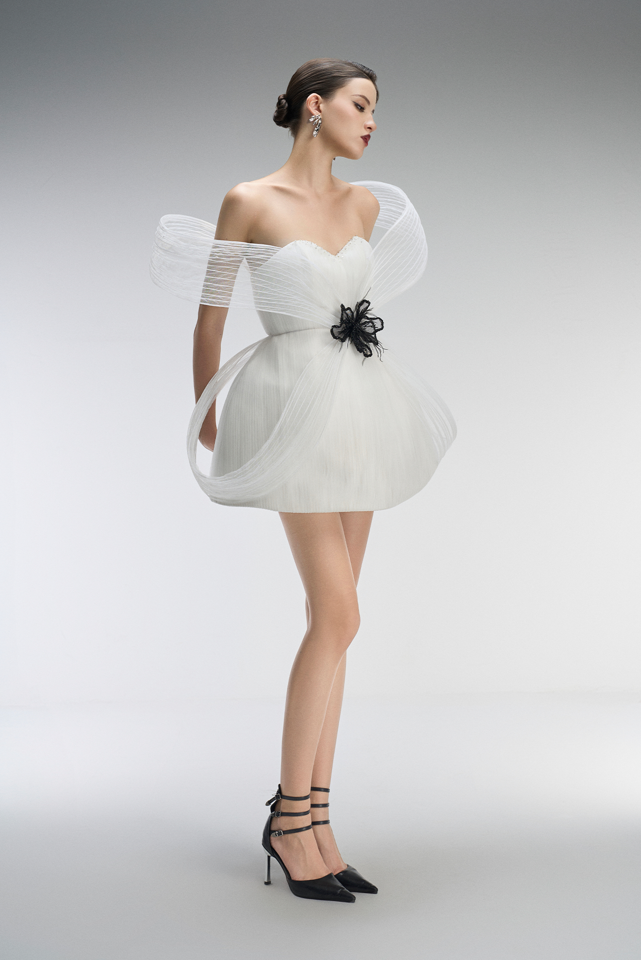 A white dress with black floral details