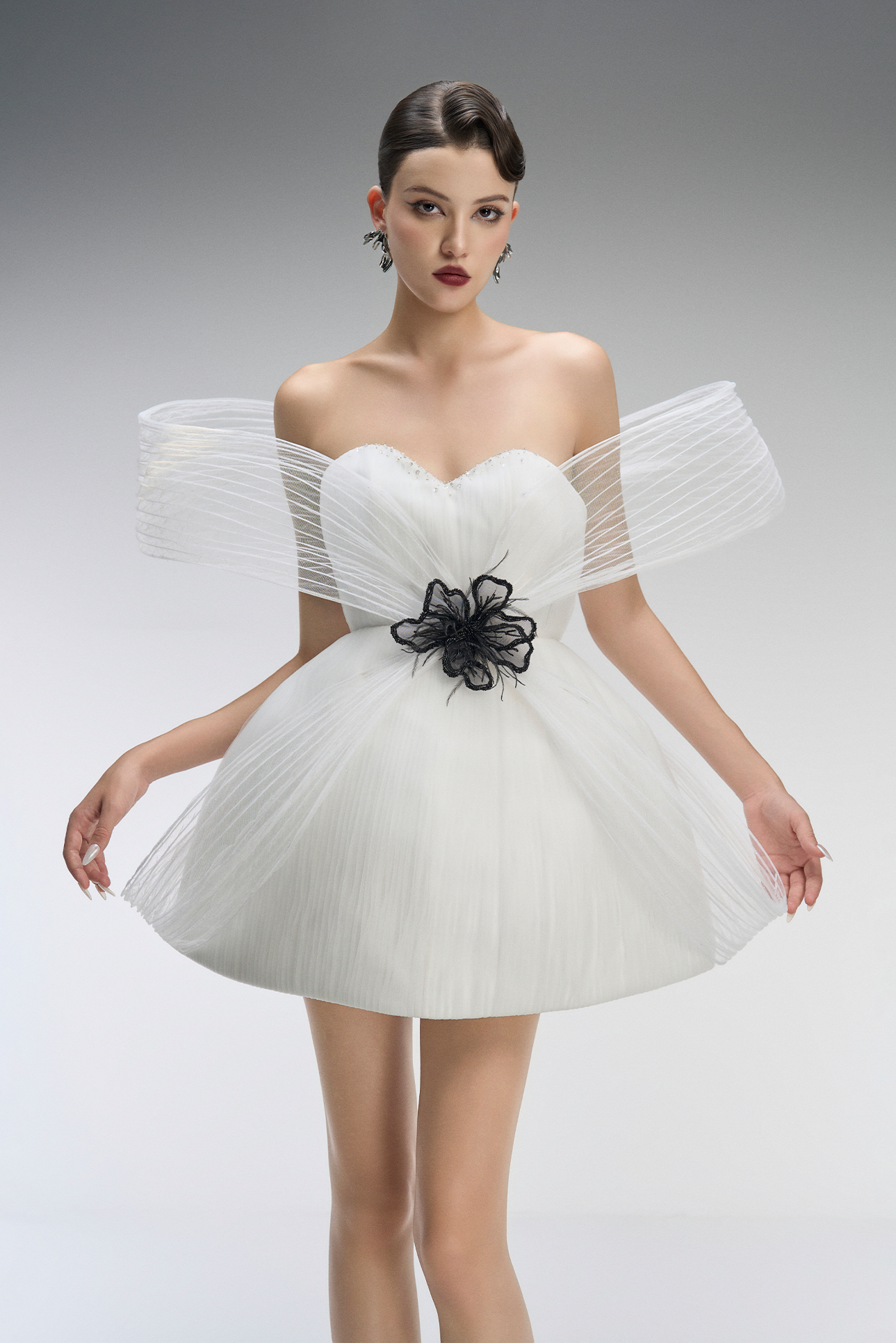 A white dress with black floral details