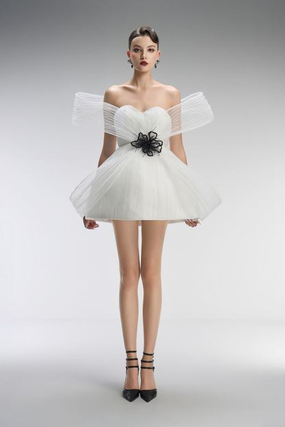 A white dress with black floral details