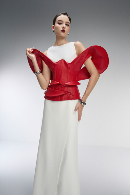 Woman wearing a red and white outfit with a gray background