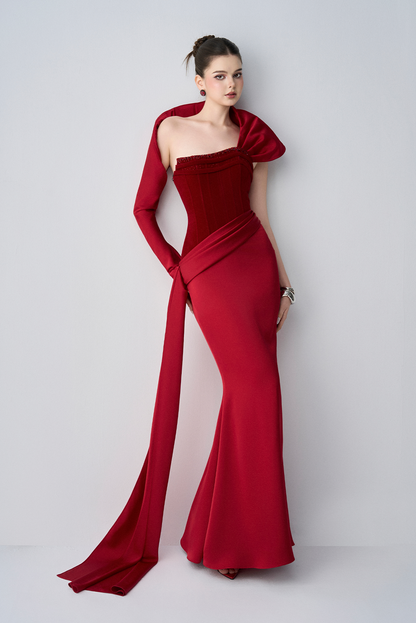 Woman wearing a red evening gown on a white background